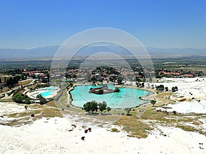 Original Pamukkale place in Turkey in Asia landscape with limestone pools with blue warm water