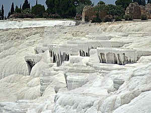 Original Pamukkale place in Turkey in Asia landscape with limestone pools with blue warm water