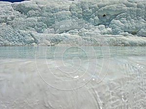 Original Pamukkale place in Turkey in Asia landscape with limestone pools with blue warm water