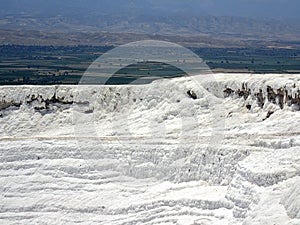 Original Pamukkale place in Turkey in Asia landscape with limestone pools with blue warm water