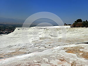 Original Pamukkale place in Turkey in Asia landscape with limestone pools with blue warm water