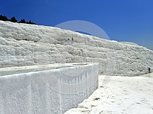 Original Pamukkale place in Turkey in Asia landscape with limestone pools with blue warm water