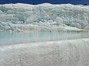 Original Pamukkale place in Turkey in Asia landscape with limestone pools with blue warm water