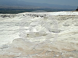 Original Pamukkale place in Turkey in Asia landscape with limestone pools with blue warm water