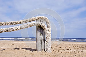 Original ropes fence on sea beach