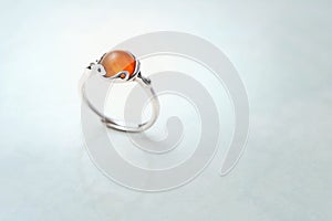 Silver ring with amber stone cabochon