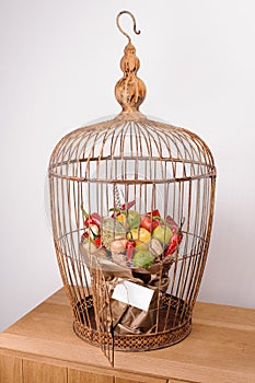 The original unusual edible vegetable and fruit bouquet with card in bird cage