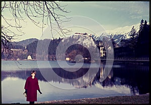 Original vintage colour slide from 1960s, woman standing by lake