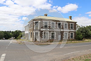 Originally built as a hotel in the 1850s, the Mansions has been used as a bank, boarding house, mushroom farm and a cannery photo