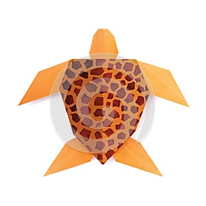 Origmi orange sea turtle with printed carapace on a white background