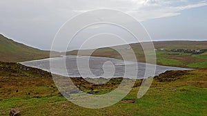 Orizontal rain above Loch Mor at Waterstein in the Isle of Skye during storm Callum - Scotland