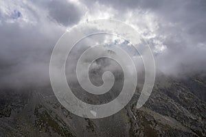 Orla Perc high mountain trail under the clouds. High Tatras