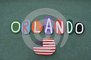 Orlando, city of Florida State, souvenir with multi colored stone letters over green sand