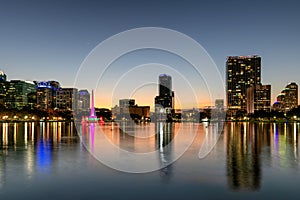 Orlando city skyline at sunset with fountain and cityscape, Florida, USA