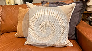 A group of pillows on a couch for sale at a Pottery Barn Retail Store in Orlando, Florida