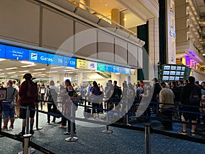 People waiting in line to go through Orlando International Airport MCO TSA security
