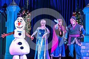 Olaf, Elsa ,Anna and Kristoff in A Frozen Holiday Wish at Magic Kingdom Park 13.