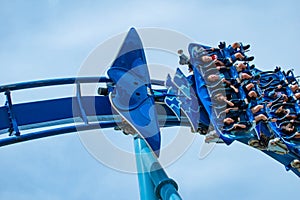 Peopla having fun amazing Manta Ray rollercoaster at Seaworld.