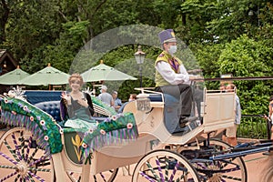 Princess Anna riding a horse drawn carriage at Epcot 138