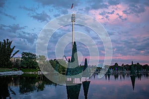 Christmas Trees on lake and Sky Tower on beautiful sunset background at Seaworld 3