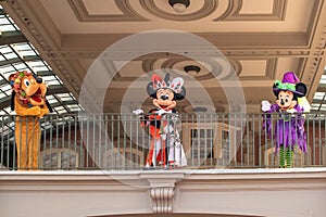 Pluto, Mickey and Minnie Mouse waving from the balcony at Walt Disney World Railroad in Halloween season at Magic Kingdom 4