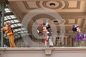 Pluto, Mickey and Minnie Mouse waving from the balcony at Walt Disney World Railroad in Halloween season at Magic Kingdom 6