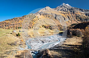 Orlegna River near Maloja Pass in the Swiss Alps on a sunny autumn day photo