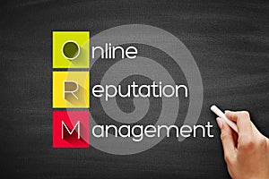 ORM - Online Reputation Management, acronym business concept background on blackboard