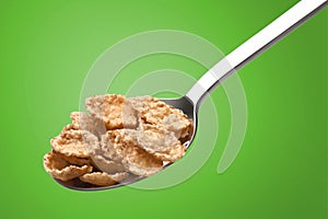 Ð¡orn flakes in a metal spoon