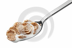 Ð¡orn flakes and yogurt in a spoon