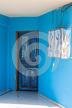 Ornament with curls on blue door photo