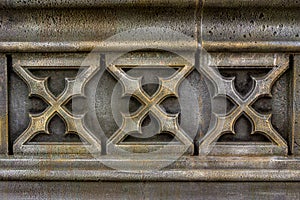 Ornament made of artificial stone, stylized as an old stone carving, selective focus