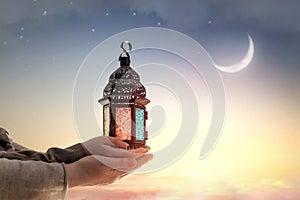 Ornamental Arabic lantern with burning candle