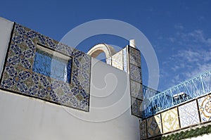 Ornamental arch on roof top terrace in Tunisia