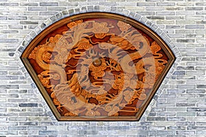 Ornamental carving of dragons on wall