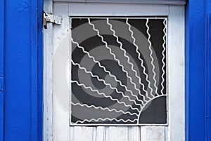 Ornamental grid on door in Diamantina, Minas Gerais