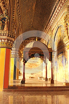 Ornamental king sarafoji siting doom and pillars in ministry hall- dharbar hall- of the thanjavur maratha palace