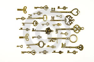 Ornamental medieval vintage keys with intricate forging, composed of fleur-de-lis elements, victorian leaf scrolls and heart shape