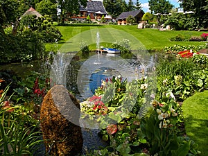 Ornamental pond and water fountain in a garden