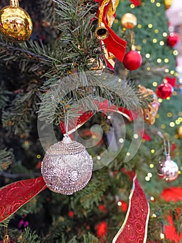 Ornamental silver balls hanging on the christmas tree