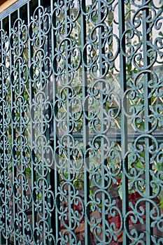 An ornamental steel grille on a building