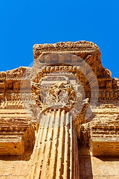 Ornamented with carving column capitel in the Temple of Bacchus, Baalbek, Lebanon photo