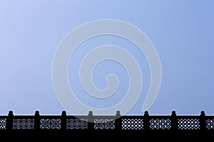 Ornamented fence against blue sky in India
