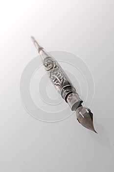 Ornamented silver vintage fountain pen in the white background