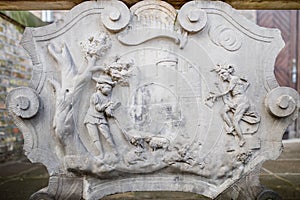 Ornaments, moldings, gargoyle, low reliefs in a sandstone, granite, concrete. sculpting details in Gdansk Danzig.