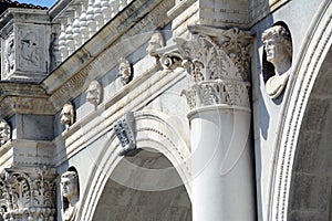Ornaments and statues busts of the Palazzo della Loggia in Brescia photo