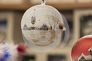 Ornaments and symbols of Christmas hanging on a market stall