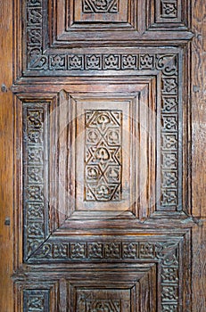 Ornaments of the wooden aged antique door, Old Cairo, Egypt photo
