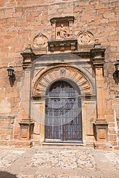 Ornate ancient door of Church San Mateo in Banos de la Encina vi photo