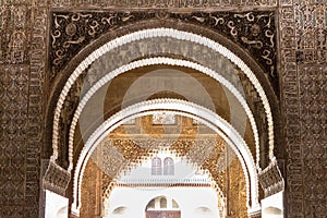 Ornate arches of Camares Patio in Alhambra, Granada, Spain photo